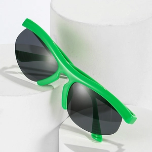 Neon green semi-rimless sporty sunglasses with oversized black lenses on a white pedestal