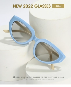 Detail view of Y2K cat-eye glasses with light blue frames and cream white temples