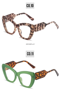 Detail view of cat eye sunglasses in tortoiseshell and olive green 45-degree angle