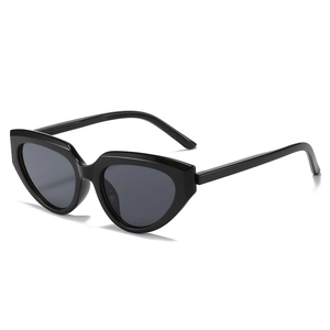 Retro Y2K cat-eye sunglasses with thick black frames and sleek geometric cutting