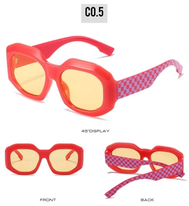 Detail view of bold red oversized frames with trendy checkerboard texture on temples