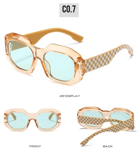 Three angles of oversized square sunglasses with orange frame and checkerboard pattern