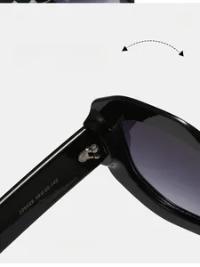 Close-up of durable metal hinge and inner temple on oversized square sunglasses