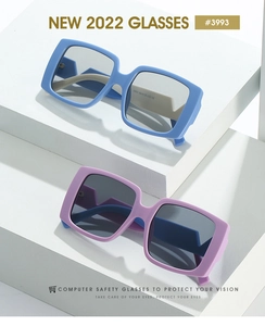 Detail of square computer safety glasses in blue and purple on a white geometric stand