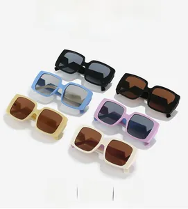 Collection of oversized square sunglasses in various pastel colors on a white background