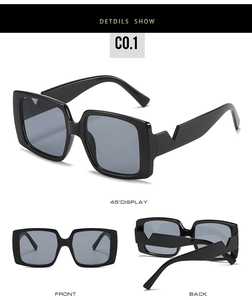 Detail view of square sunglasses with V-shaped geometric temple design in glossy black