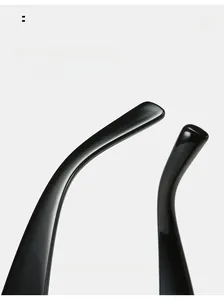 Close-up of curved glossy black temples designed for comfortable fit on cycling sunglasses