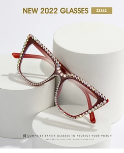 Detail of red cat-eye computer safety glasses with luxury rhinestone embellishments