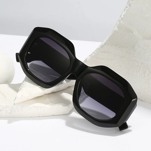 Chic oversized geometric sunglasses for women with black thick frames and dark grey lenses