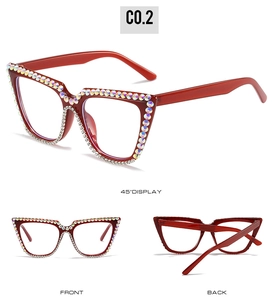 Detail view of burgundy cat-eye sunglasses with rhinestone trim from multiple angles