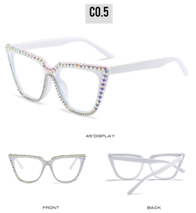 Detail view of white cat-eye sunglasses with luxury colorful rhinestone embellishments