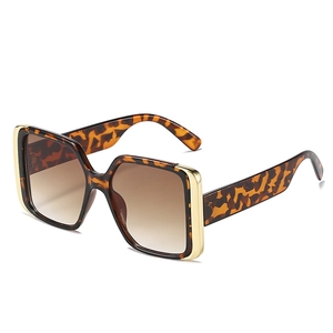 Fashionable oversized square tortoiseshell sunglasses with brown gradient lenses and gold metal accents