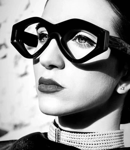 Macro side view of avant-garde geometric thick frame sunglasses with sharp industrial lines