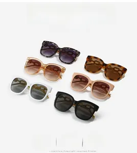 Detail of square oversized sunglasses showing six stylish colors and gold chain temple design