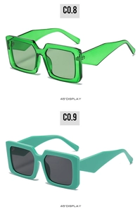 Detailed 45-degree view of square frame sunglasses in transparent and mint green