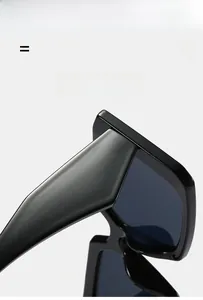 Detailed close-up showing the lightweight, super elastic black wide-leg frame sunglasses