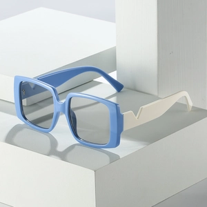 Square oversized sunglasses in bright blue and cream white with unique V-cut temples