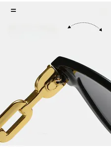 Macro shot of durable golden chain hinges on stylish black square frame sunglasses