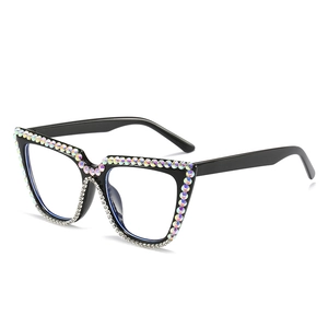 Black cat-eye sunglasses with colorful rhinestones and crystals on white background