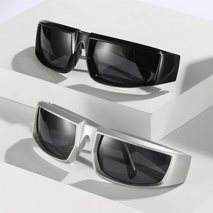 Futuristic wrap-around cycling sunglasses in black and metallic silver on a display stand