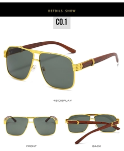 Detail view of pilot style sunglasses with wood grain temples and gold metal frames