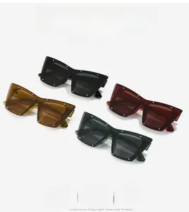 Macro shot of oversized cateye sunglasses with silver rivets in four stylish colors