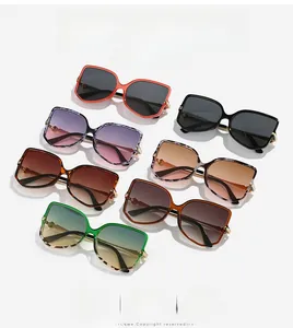 Seven colorful oversized sunglasses display featuring metal and acetate temples