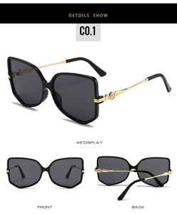 Three views of black hexagonal sunglasses with decorative gold metal temples and gray lenses