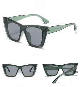 Three perspectives of green cat eye sunglasses with silver rivets and grey lenses