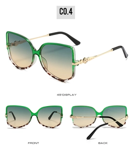 Detailed views of green translucent square sunglasses with gold metal temples and gradient lenses