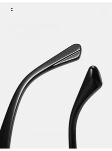 Detail of curved ergonomic temple legs on polished black cat-eye sunglasses for comfort