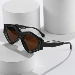 Futuristic cat-eye sunglasses with chunky black geometric frames and dark lenses