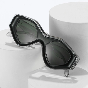 Futuristic cat-eye sunglasses with double-layered clear resin frame and black lenses