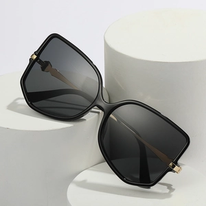Chic black oversized geometric sunglasses with gold metal hinges for stylish women