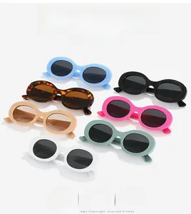 Flat lay of oval sunglasses in light blue, black, tortoiseshell and pastel colors