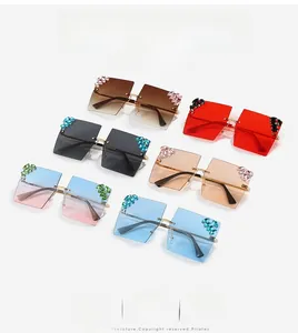 Detailed view of oversized rimless square sunglasses with luxury rhinestone accents