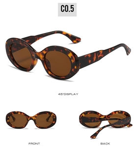 Detail view of oval tortoise shell sunglasses with brown lenses and C0.5 logo
