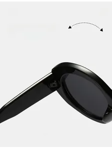 Close-up of durable metal hinge on black oval sunglasses showing premium craftsmanship