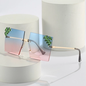 Frameless oversized square sunglasses with blue-pink gradient lenses and rhinestone accents