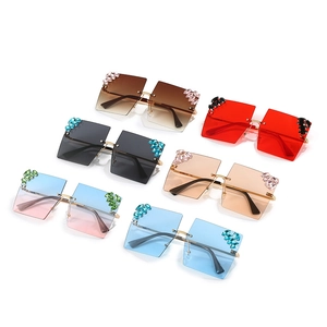 Oversized rimless square sunglasses with rhinestone clusters in six diverse colors