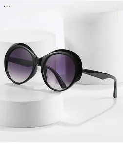 Detail shot of vintage round sunglasses with black frames and purple gradient lenses