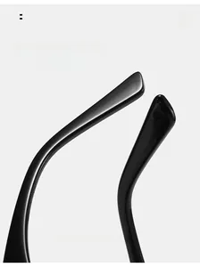 Detail of curved ergonomic sunglasses temples in polished black resin for comfort
