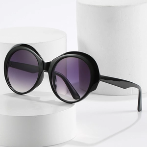 Retro oversized round sunglasses with black frames and purple gradient lenses for women