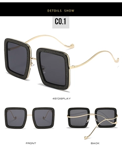 Three-angle views of square black glitter sunglasses with gold metal temples and grey lenses