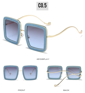 Detailed views of glittery blue square sunglasses with slender gold metal temples