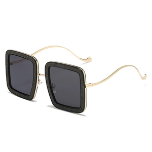 Square black sunglasses with starlight glitter finish and slender gold metal temples