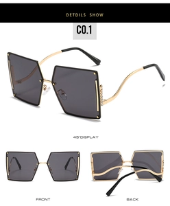 Detail of rimless gradient sunglasses with wavy gold metal temples and rhinestone accents