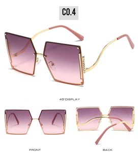 Detail of rimless gradient sunglasses featuring rhinestone-studded gold metal temples