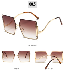 Three angles of rimless diamond-set sunglasses with gradient lenses and gold metal frames