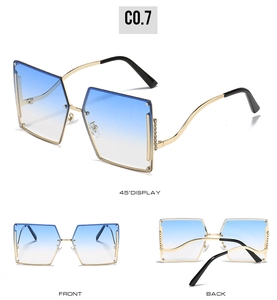 Detail view of rimless gradient sunglasses with gold metal frame and rhinestone accents